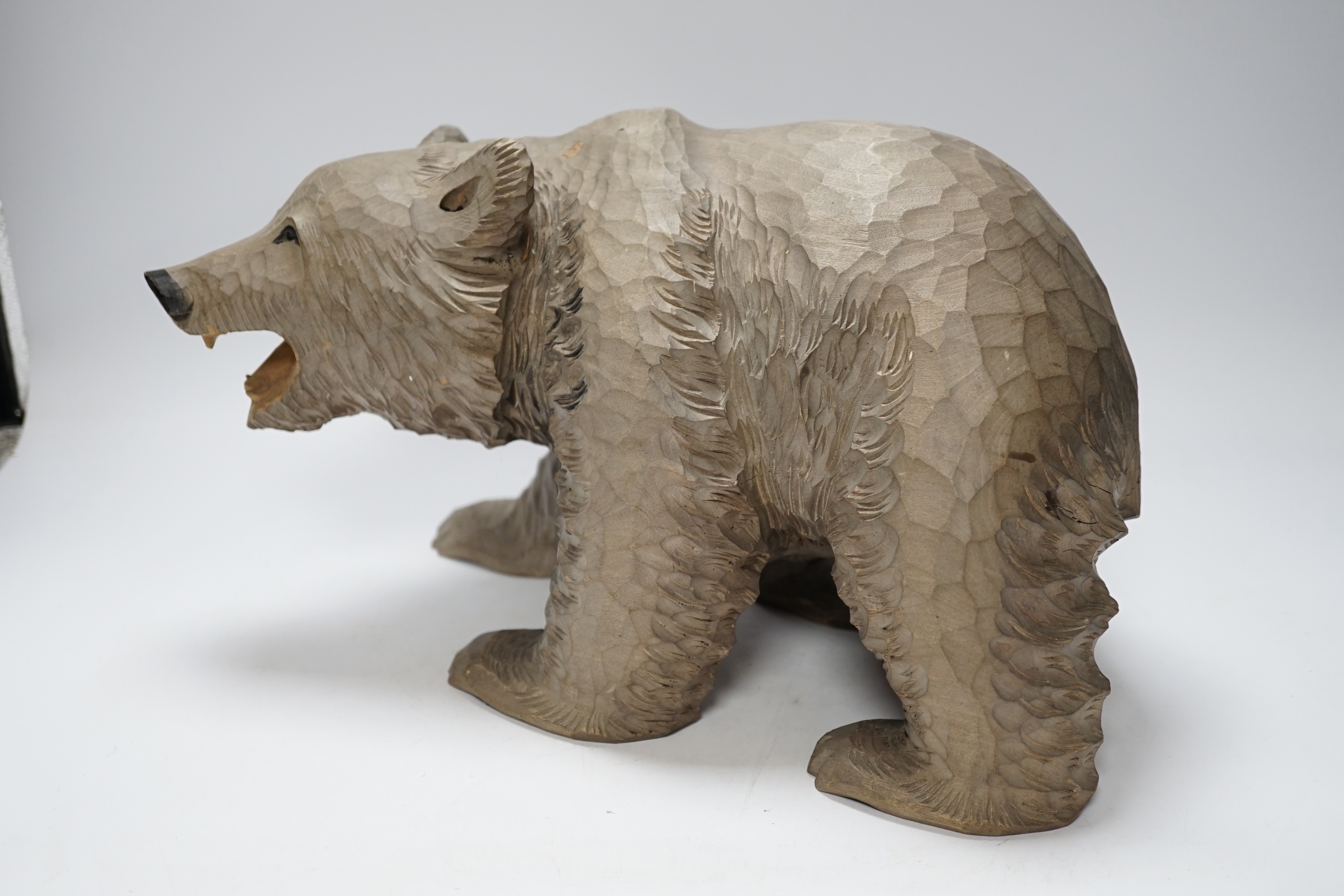 A Japanese carved wood bear, 32cm long